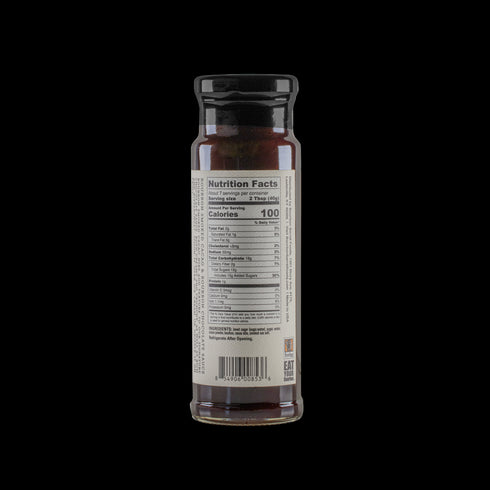 Bourbon Barrel Foods Chocolate Sauce with Bourbon Smoked Cacao Nibs and nutrition facts on back of bottle.